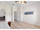 Office space featuring wood flooring, a ceiling fan, and a light-colored desk and chair at 7220 Nw 83 Ter, Ocala, FL 34482