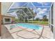 Inviting screened-in pool and spa offer a refreshing retreat with serene backyard views at 7220 Nw 83 Ter, Ocala, FL 34482