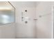 A clean and well-lit walk-in shower with white tiles and chrome fixtures at 7220 Nw 83 Ter, Ocala, FL 34482