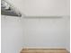 Empty walk-in closet featuring wood floor and wire shelving ready to be filled at 7220 Nw 83 Ter, Ocala, FL 34482