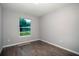 A light-filled empty bedroom with hardwood-style floors and ample space, ready for personalization at 7364 Sw 133 Ne Loop, Ocala, FL 34473