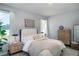Serene bedroom featuring soft natural light, neutral decor, and elegant furnishings at 7364 Sw 133 Ne Loop, Ocala, FL 34473