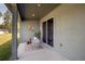 Inviting patio with modern chairs and table, perfect for relaxing and enjoying the outdoor scenery at 7364 Sw 133 Ne Loop, Ocala, FL 34473
