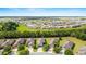 Aerial view of a community with tree lined streets and perfectly manicured landscaping at 7707 Sw 94Th Cir, Ocala, FL 34481