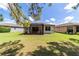 Expansive backyard showing the outdoor screened patio for entertaining and relaxation at 7707 Sw 94Th Cir, Ocala, FL 34481