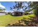Lush backyard and outdoor patio create a peaceful retreat in this home's backyard at 7707 Sw 94Th Cir, Ocala, FL 34481