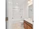 Full bathroom featuring a shower-tub combo, single sink vanity, and neutral color palette at 7707 Sw 94Th Cir, Ocala, FL 34481