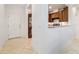 Open-concept entryway flows into the kitchen with granite countertops and tile floors at 7707 Sw 94Th Cir, Ocala, FL 34481