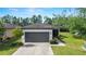 Charming single-story home features a 2-car garage, well-maintained landscaping, and inviting entrance at 7707 Sw 94Th Cir, Ocala, FL 34481