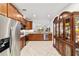 Bright kitchen featuring stainless steel appliances, granite counters, and tile flooring at 7707 Sw 94Th Cir, Ocala, FL 34481