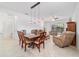 Bright dining room and living room with open layout at 7707 Sw 94Th Cir, Ocala, FL 34481