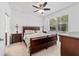 Cozy main bedroom featuring a large bed, and ample natural light at 7707 Sw 94Th Cir, Ocala, FL 34481