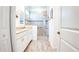 Modern bathroom boasts a glass-enclosed shower and a vanity with double sinks at 7765 Sw 86Th Loop, Ocala, FL 34476