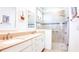 Modern bathroom boasts a glass-enclosed shower and a vanity with double sinks at 7765 Sw 86Th Loop, Ocala, FL 34476