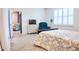 Comfortable bedroom with wood floors, natural light, and views into other rooms at 7765 Sw 86Th Loop, Ocala, FL 34476