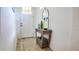 Bright foyer showcasing a decorative table, and a white front door and white walls at 7765 Sw 86Th Loop, Ocala, FL 34476
