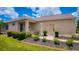 Attractive home exterior with manicured landscaping, complemented by a welcoming entryway at 7765 Sw 86Th Loop, Ocala, FL 34476