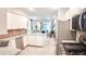Open kitchen view showcases granite countertops, stainless appliances, and connection to the living area at 7765 Sw 86Th Loop, Ocala, FL 34476
