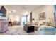 Open-concept living room with lots of natural light, neutral paint, ceiling fan and modern decor at 7765 Sw 86Th Loop, Ocala, FL 34476