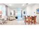 Bright, open living room featuring wood-look tile, recessed lighting, and sliding glass doors at 7765 Sw 86Th Loop, Ocala, FL 34476