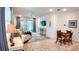 Bright, open living room featuring wood-look tile, recessed lighting, and sliding glass doors at 7765 Sw 86Th Loop, Ocala, FL 34476
