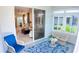 Cozy sunroom overlooking the living room with large sliding glass doors and comfortable seating at 7765 Sw 86Th Loop, Ocala, FL 34476