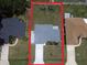 An aerial view reveals a home on a spacious lot with mature landscaping at 8187 Sw 60Th Ter, Ocala, FL 34476