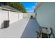 Enclosed backyard featuring a vinyl fence, a cement patio, and an open area at 8187 Sw 60Th Ter, Ocala, FL 34476