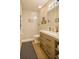 Modern bathroom features a glass shower enclosure with neutral tile, wood grain vanity, and new fixtures at 8187 Sw 60Th Ter, Ocala, FL 34476