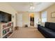 Bright bedroom featuring a ceiling fan, walk-in closet, and comfortable furniture at 8187 Sw 60Th Ter, Ocala, FL 34476