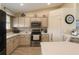 Well-lit kitchen features stainless steel appliances and mosaic tile backsplash at 8187 Sw 60Th Ter, Ocala, FL 34476