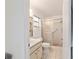 Bright bathroom featuring a shower with sliding glass doors and updated fixtures at 8677 Sw 95Th Ln # A, Ocala, FL 34481