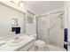 Bright bathroom featuring a shower with sliding glass doors and tiled floors at 8677 Sw 95Th Ln # A, Ocala, FL 34481
