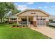 Welcoming home with inviting porch, complemented by a lush lawn and attached garage at 8677 Sw 95Th Ln # A, Ocala, FL 34481