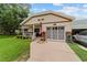 Inviting home with a cozy front porch, lush landscaping, and convenient attached garage at 8677 Sw 95Th Ln # A, Ocala, FL 34481