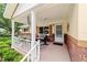 Cozy front porch with seating, ceiling fan, and decorative accents at 8677 Sw 95Th Ln # A, Ocala, FL 34481