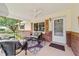 Inviting front porch with comfortable seating and ceiling fan at 8677 Sw 95Th Ln # A, Ocala, FL 34481