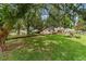 Well-maintained lawn with mature trees shading charming home at 8677 Sw 95Th Ln # A, Ocala, FL 34481