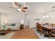 Comfortable living area featuring a plush sofa, wood floors, and neutral walls at 8677 Sw 95Th Ln # A, Ocala, FL 34481