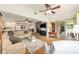 Spacious living room with an open layout, connecting to the kitchen, dining, and outdoor patio at 8677 Sw 95Th Ln # A, Ocala, FL 34481