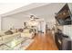 Bright living room with an open floor plan, leading into the kitchen and dining area at 8677 Sw 95Th Ln # A, Ocala, FL 34481