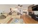 Bright living room with an open floor plan, fireplace, and seamless flow to the kitchen and dining area at 8677 Sw 95Th Ln # A, Ocala, FL 34481
