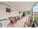 Relaxing screened patio with comfortable seating area, perfect for outdoor enjoyment at 8677 Sw 95Th Ln # A, Ocala, FL 34481