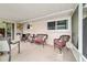 Relaxing screened patio with comfortable seating area, perfect for outdoor enjoyment at 8677 Sw 95Th Ln # A, Ocala, FL 34481