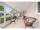 Relaxing screened patio with comfortable seating area, perfect for outdoor enjoyment at 8677 Sw 95Th Ln # A, Ocala, FL 34481