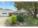 Lush backyard featuring mature trees, shrubs, and a screened patio, offering a serene outdoor living space at 9065 Sw 82Nd Ter # G, Ocala, FL 34481