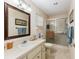 Well-lit bathroom with a shower, vanity, and neutral color palette at 9065 Sw 82Nd Ter # G, Ocala, FL 34481