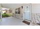 Cozy front porch featuring stone accents, a 'welcome' mat, and a well-lit entryway at 9065 Sw 82Nd Ter # G, Ocala, FL 34481