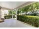Spacious covered front porch with views of the lush landscaping and neighborhood at 9065 Sw 82Nd Ter # G, Ocala, FL 34481