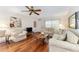 Open living room featuring hardwood floors, a ceiling fan, and comfortable seating at 9065 Sw 82Nd Ter # G, Ocala, FL 34481